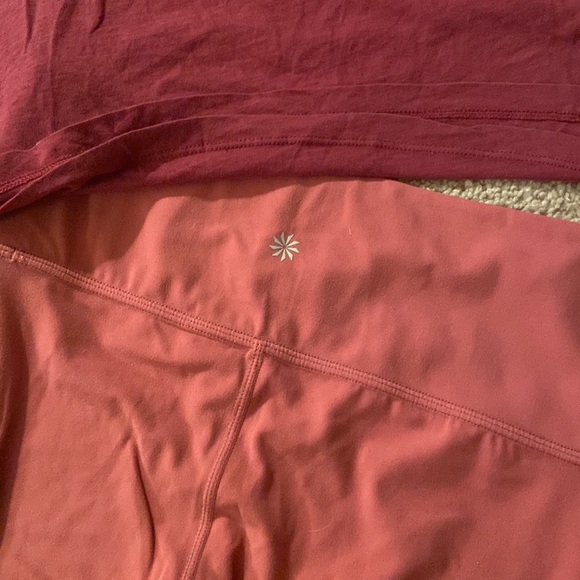 This is a bundle of athleta and there is 2 shirts and 2 pairs of leggings. - Picture 2 of 3
